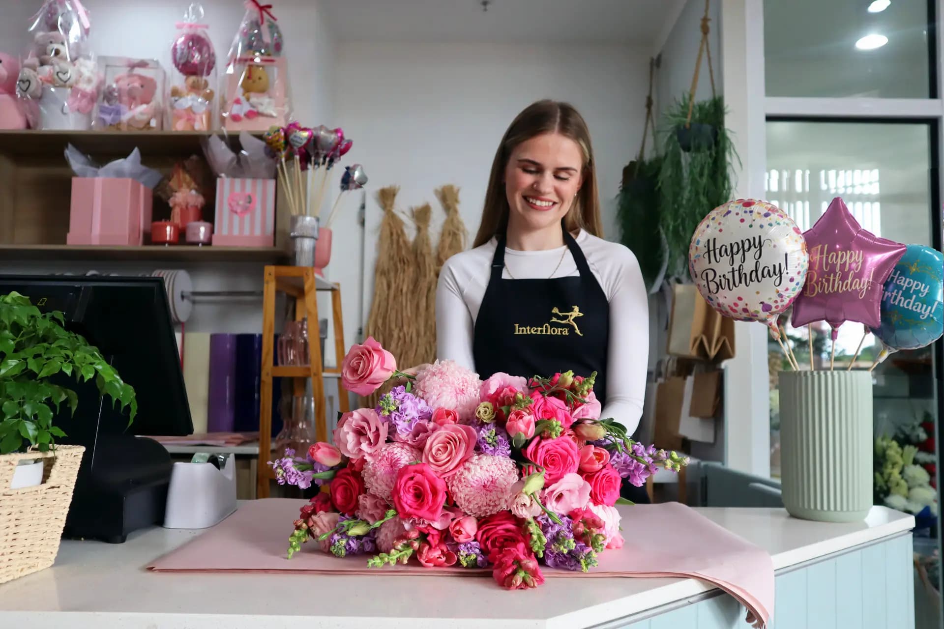A florist arranging fresh flowers